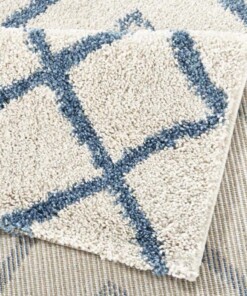 Hoogpolig modern vloerkleed Maison - blauw/crème - close up