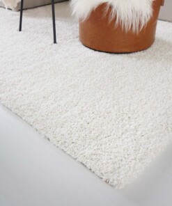Hoogpolig vloerkleed shaggy Trend effen - crème - close up hoek
