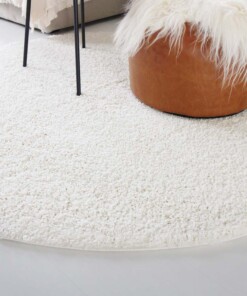 Hoogpolig vloerkleed shaggy Trend effen rond - crème - close up zijkant