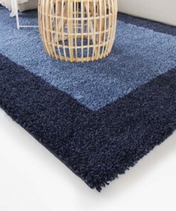 Hoogpolig vloerkleed shaggy Trend lijstmotief - blauw - close up hoek