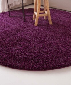 Hoogpolig vloerkleed shaggy Trend effen rond - paars - close up zijkant