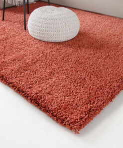 Hoogpolig vloerkleed shaggy Trend effen - terracotta - close up hoek