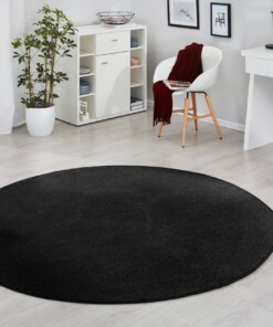 Modern effen vloerkleed rond Fancy - zwart - sfeer