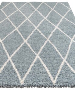 Scandinavisch vloerkleed Elle Decoration Abbe - blauw/crème - overzicht schuin, thumbnail