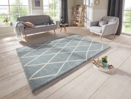 Scandinavisch vloerkleed Elle Decoration Abbe - blauw/crème - sfeer