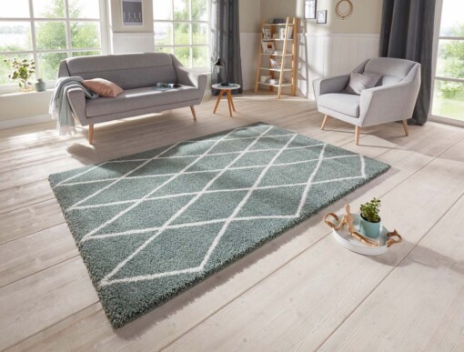 Scandinavisch vloerkleed Elle Decoration Abbe - groen/crème - sfeer