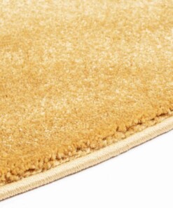 Rond vloerkleed effen velours Gala - geel - close up zijkant, thumbnail Rond vloerkleed effen velours Gala - geel - close up zijkant, thumbnail