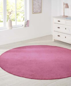 Modern effen vloerkleed rond Nasty - roze - sfeer