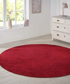 Modern effen vloerkleed rond Nasty - rood - sfeer