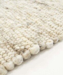 Wollen vloerkleed handweef Ylva - beige - close up zijkant, thumbnail