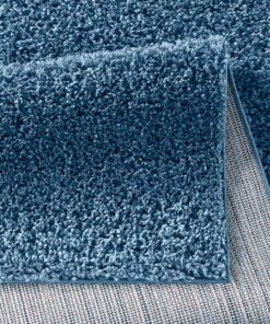 Hoogpolig vloerkleed effen Spectrum - blauw - close up vouw, thumbnail Hoogpolig vloerkleed effen Spectrum - blauw - close up vouw, thumbnail