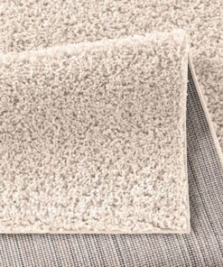 Hoogpolig vloerkleed effen Spectrum - crème - close up vouw, thumbnail