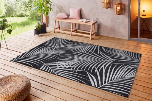 Binnen & buiten vloerkleed Tropical leaf - zwart/crème - sfeer