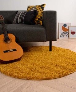 Rond hoogpolig vloerkleed shaggy Trend effen - okergeel - sfeer