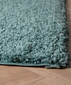 Hoogpolig vloerkleed shaggy Trend effen - lichtblauw - close up hoek