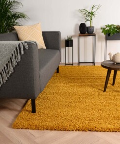 Hoogpolig vloerkleed shaggy Trend effen - okergeel - sfeer