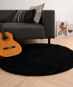 Rond hoogpolig vloerkleed shaggy Trend effen - zwart - sfeer