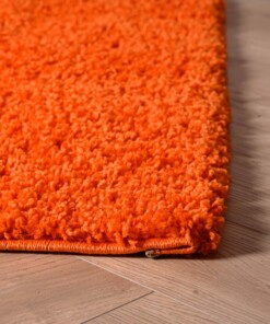 Vierkant hoogpolig vloerkleed shaggy Trend effen - oranje - close up hoek