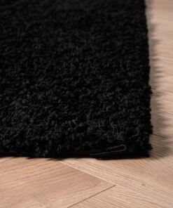 Vierkant hoogpolig vloerkleed shaggy Trend effen - zwart - close up hoek