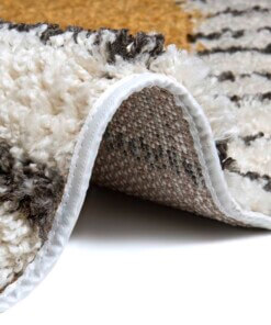 Rond vloerkleed kinderkamer Lion Tahl - crème/okergeel - close up, thumbnail Rond vloerkleed kinderkamer Lion Tahl - crème/okergeel - close up, thumbnail