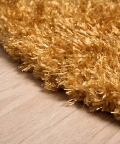 Rond hoogpolig vloerkleed velours Posh - goud - close up zijkant, thumbnail