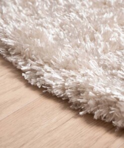 Rond hoogpolig vloerkleed velours Posh - ivoor - close up zijkant