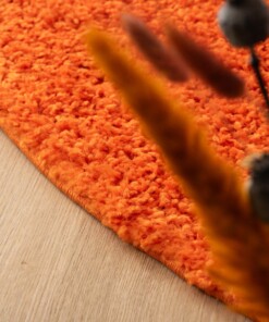 Rond hoogpolig vloerkleed shaggy Trend effen - oranje - close up, thumbnail Rond hoogpolig vloerkleed shaggy Trend effen - oranje - close up, thumbnail