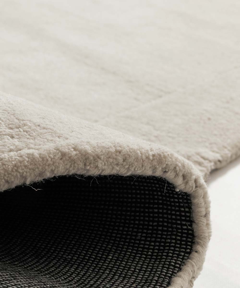 Organisch wollen vloerkleed - Flyt Pebble ivoor - close up Organisch wollen vloerkleed - Flyt Pebble ivoor - close up