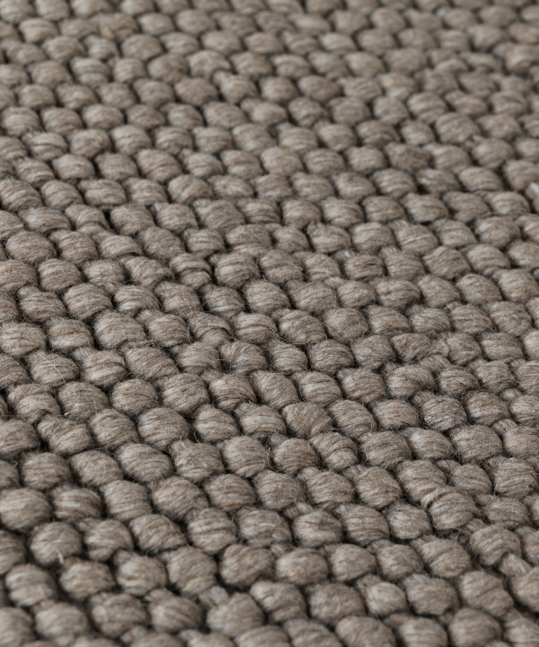 Rond wollen vloerkleed - Løkke zandkleur - close up Rond wollen vloerkleed - Løkke zandkleur - close up