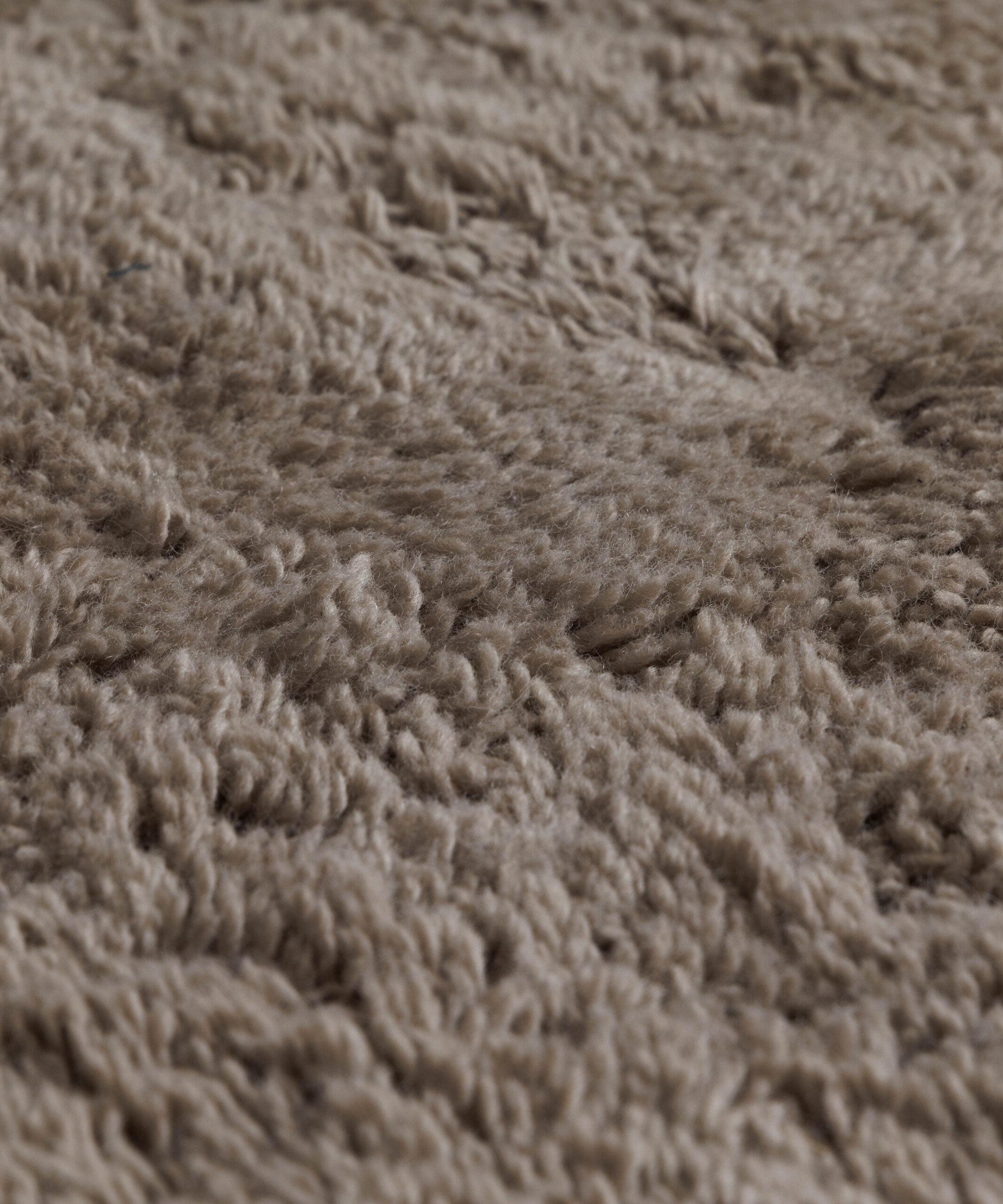 Organisch vloerkleed - Tjørne Swell taupe - close up Organisch vloerkleed - Tjørne Swell taupe - close up